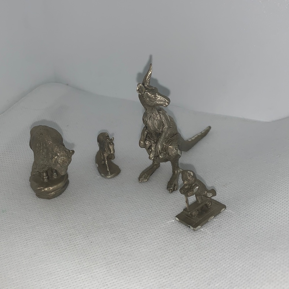 Set of 4 pewter animals, Buffalo , kangaroo,zebra & bear on scooter